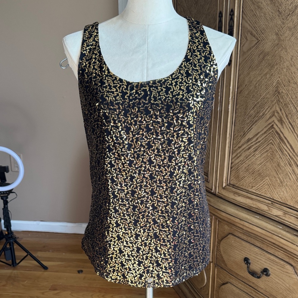NWOT Manoukian Black lined Top with a layer of gold sequence over tule on front